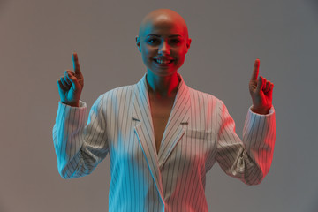 Portrait of an attractive bald woman wearing jacket