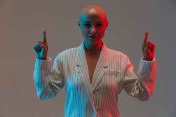 Portrait of an attractive bald woman wearing jacket