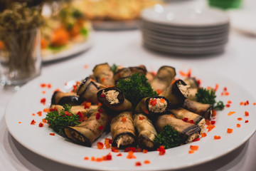 Beautifully decorated catering banquet table with different food snacks and appetizers on corporate, christmas, birthday party event or wedding celebration