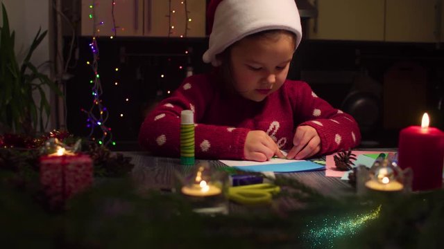 New Year animation. Little girl gluing New Year card. The trace of the magic wand moving through the screen.