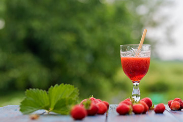 strawberry and fresh strawberry in a crystal glass