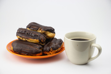 Chocolate eclairs with hot coffee
