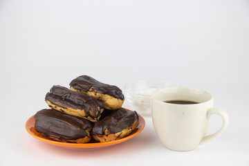 Chocolate eclairs with hot coffee