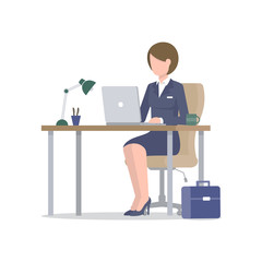 Business woman with laptop at desk with suitcase