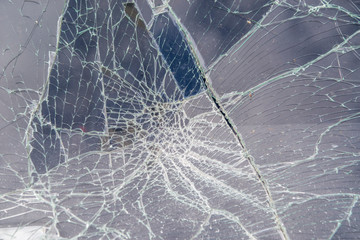 Obraz premium Broken in cracks windshield of the Car