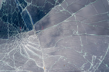 Broken in cracks windshield of the Car