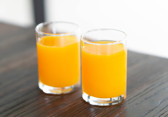 Closeup orange juice on wood table, drink for healthy concept, selective focus