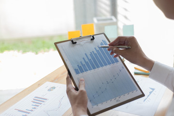 The young accountant is checking the money of a reputable national financial organization in a country.