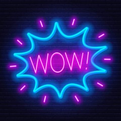 Neon sign of word wow in frame on dark background. Light banner on the wall background.