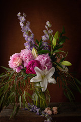 Obraz na płótnie Canvas a beautiful bouquet of flowers lilies peonies roses card Wallpaper