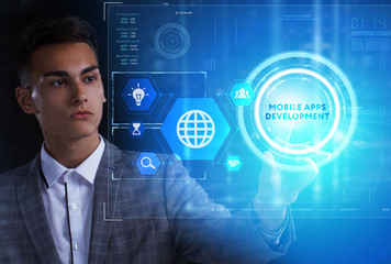 The concept of business, technology, the Internet and the network. A young entrepreneur working on a virtual screen of the future and sees the inscription: Mobile apps development