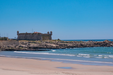 17th century fort in Porto, Portugal known as Castelo do Queijo. Viewed over beach.
