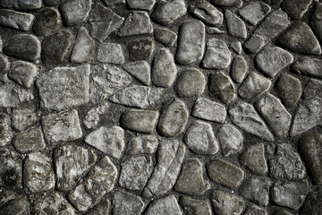 old stone pavement background / abstract pavement, large cobblestones, old road texture