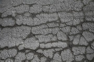asphalt in cracks texture / abstract background cracks on asphalt road