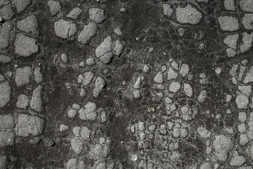 asphalt in cracks texture / abstract background cracks on asphalt road