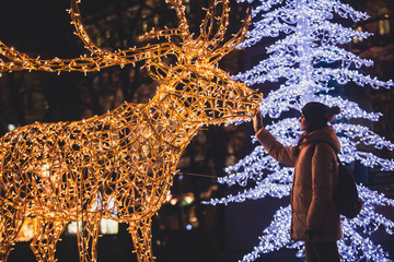 Christmas decorations in the streets of Helsinki, with evening light illumination, concept of...