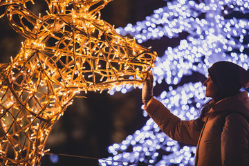 Christmas decorations in the streets of Helsinki, with evening light illumination, concept of...