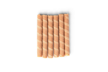 Sweet chocolate waffle rolls isolated on white background.