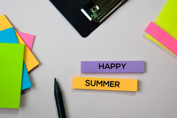 Happy Summer text on sticky notes with office desk concept