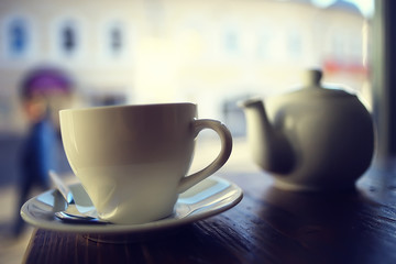 cup in an outdoor cafe / breakfast concept in a cafe, coffee, tea, morning drink