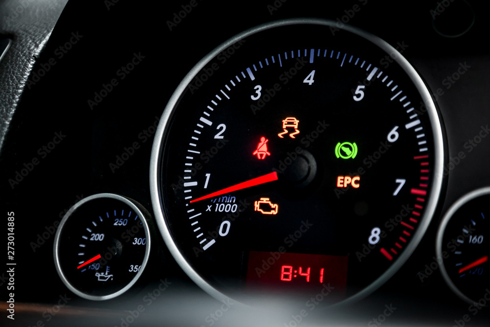 Wall mural Interior view of car with black salon. Modern luxury prestige car interior: speedometer, dashboard and tachometer  with white backlight and other buttons. Soft focus