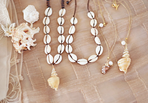 bohemian summer jewelry with shells - cowrie shells necklaces - fashion jewelry advertisement