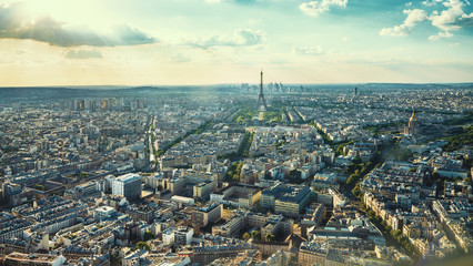 Paris street with view on the famous paris eiffel tower on a sunny day with some sunshine