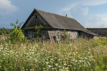 Traditional rural landscape in Russia. Village house in summer.