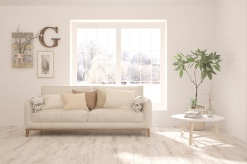 Stylish room in white color with sofa and winter landscape in window. Scandinavian interior design. 3D illustration