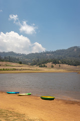 Fototapeta premium kayaking boat at lake shore for water adventure