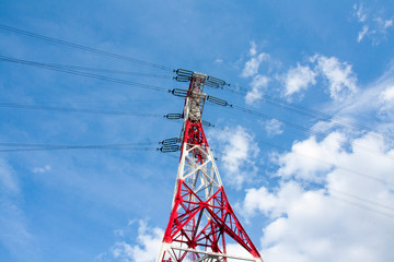 High voltage tower on sky background. Power line. Bottom view