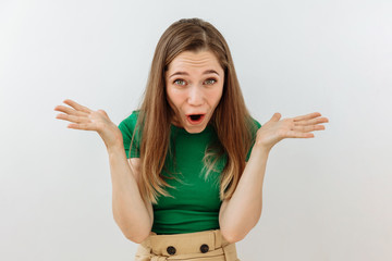 Surprised,shock ,unbelievable emotion. Young woman face portrait agaist white backgraund.