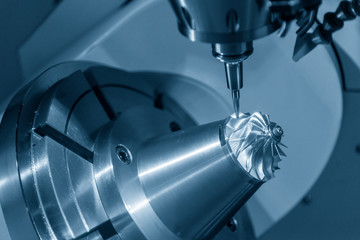 The 5-axis CNC milling machine cutting the turbine part with the taper ball endmill tool.The table...
