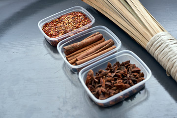 Obraz na płótnie Canvas Spices in plastic containers with bamboo brush