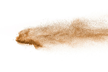 Plakat Explosion of brown powder on white background.