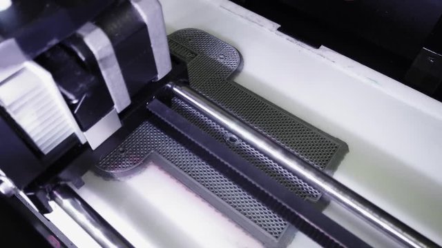Automatic three dimensional 3d printer performs product creation. Modern 3D printing can halp to make prototype..