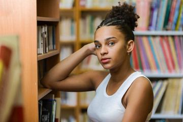 Black african american young girl student studying at the school university library