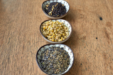 Earl Grey and Chamomile tea on a wooden table 