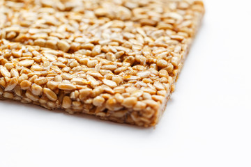 Healthy snacks. Fitness diet food. Kozinaki fritter, seeds, energy bars. White background top view. Isolate, Copy Space