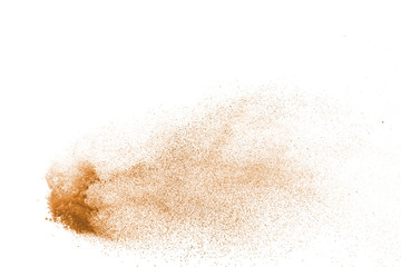 Explosion of brown powder on white background.