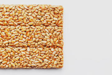 Healthy snacks. Fitness diet food. Kozinaki fritter, seeds, energy bars. White background top view. Isolate, Copy Space