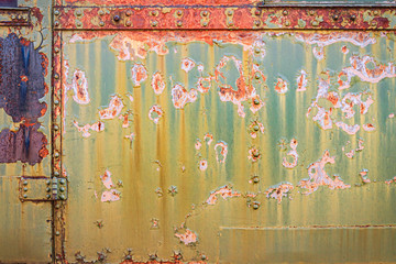 Close-up of a rusty painted metal surface