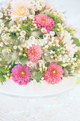Obraz na płótnie Canvas Light floral wedding bouquet decoration with pink Dalhias bleached toning