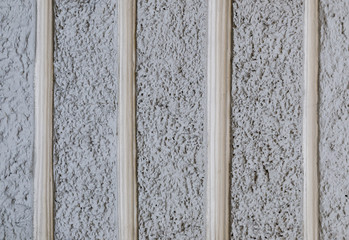 Texture of the gray wall of a baroque building