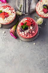 Obraz na płótnie Canvas Panna cotta with berry sauce, raspberries and fresh mint.