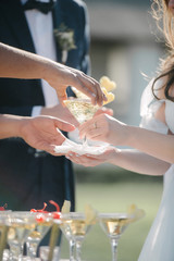Man pours champagne into a glass from a bottle