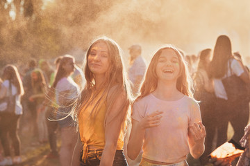 Portrait of happy young girls on holi color festival