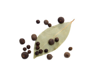 Bay leaf, allspice and pepper isolated on white background