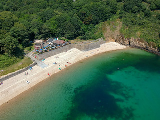 Guernsey beach Fermain bay channel Islands. Guernsey coastline with sea, cliffs and boat, island, UK, Europe