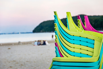 Colorfoul deckchairs with sand and beach